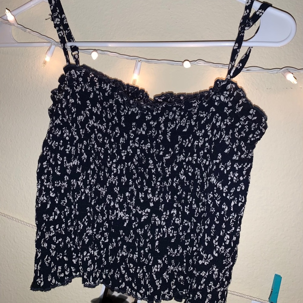 Blue tank top with white flowers.